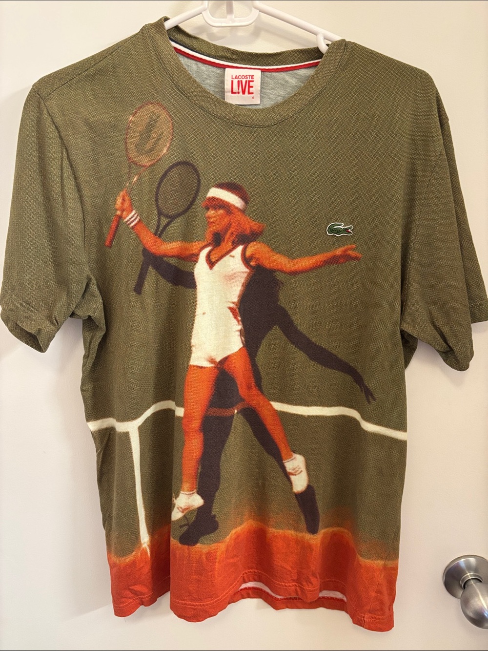 Lacoste Olive Green Tee with Orange Tennis Graphic